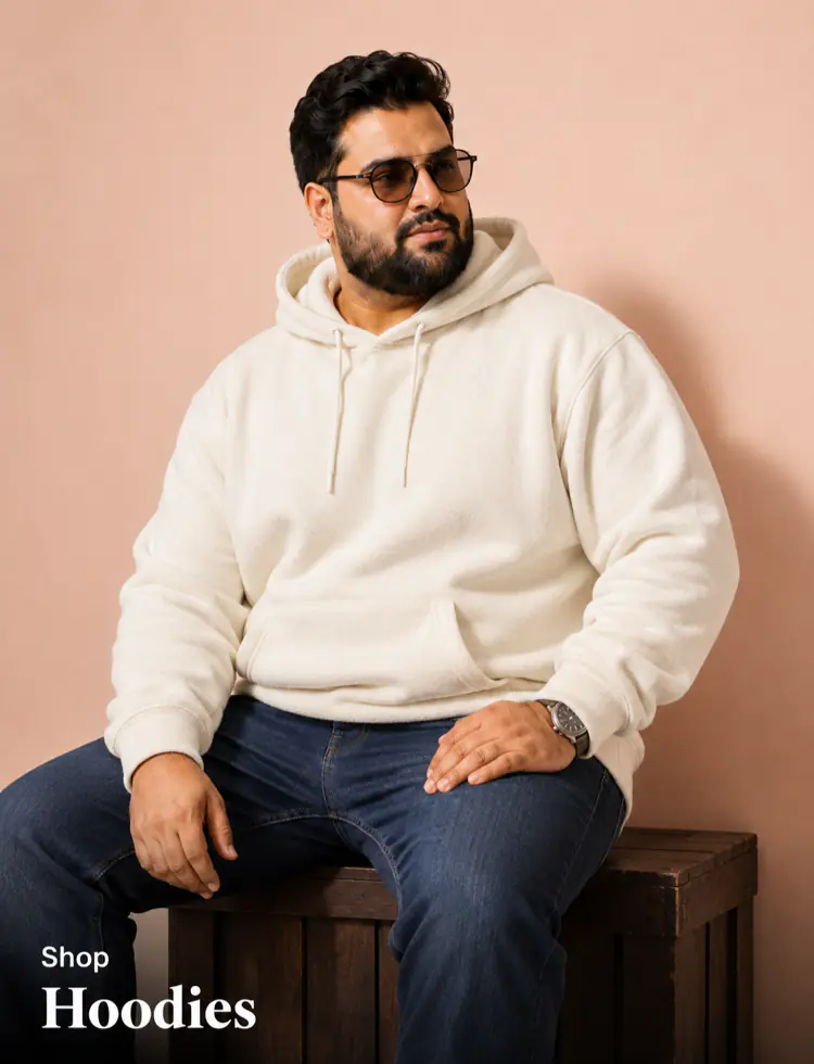 Plus size hoodies for men Pakistan - heavyset model seated in cream fleece hoodie