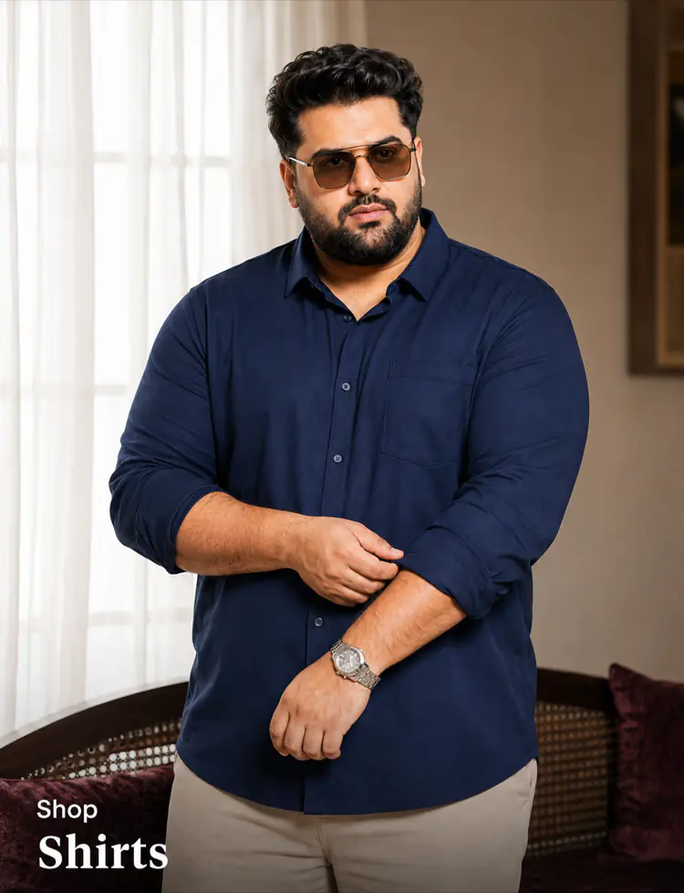 Big size shirts Pakistan - plus size man in navy shirt and sunglasses standing indoors